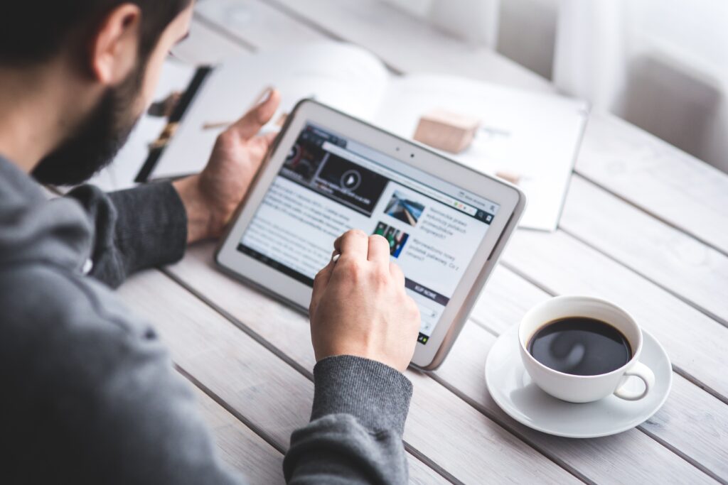 A person reading from his tablet